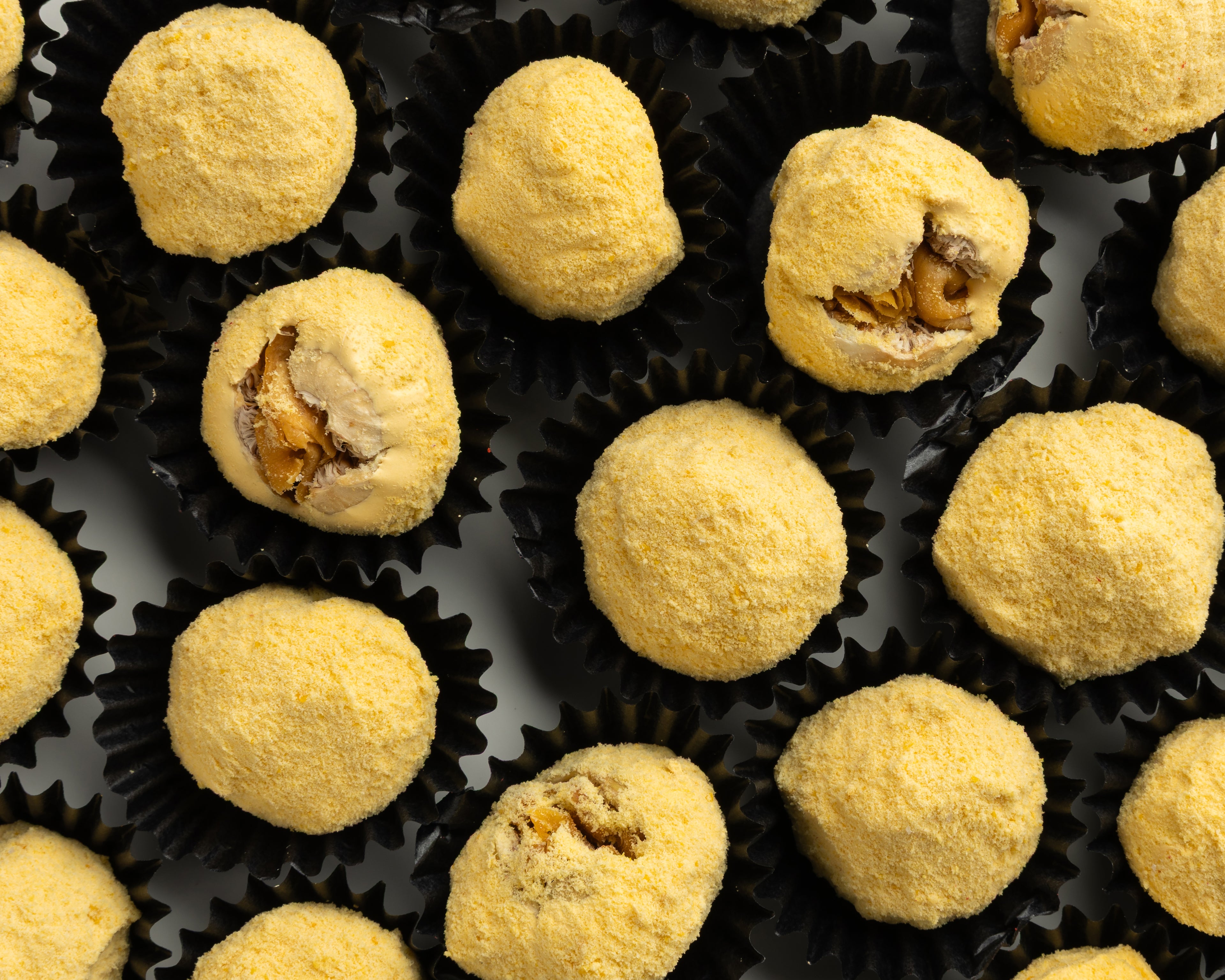 Closeup of mango coating on fig bite