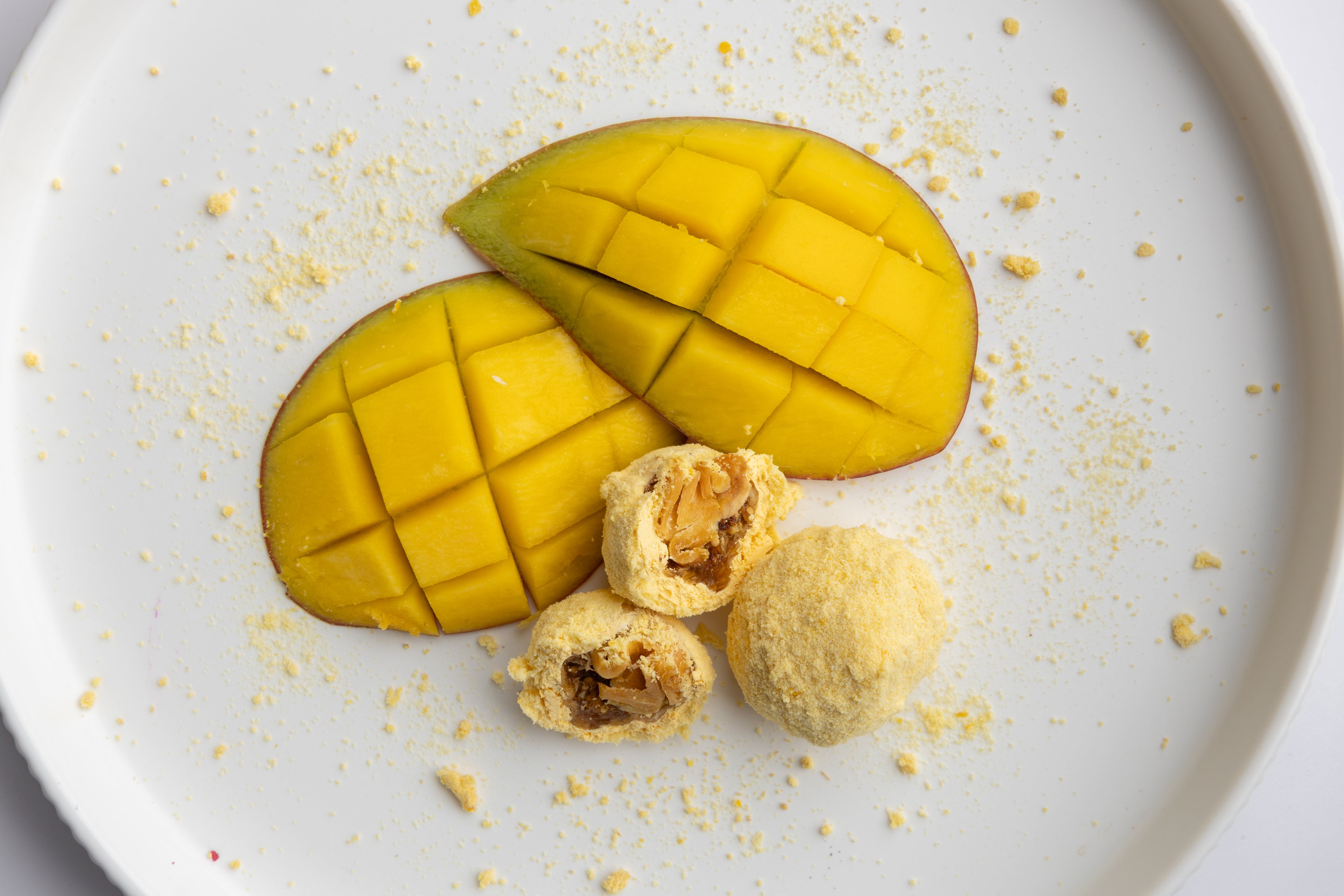 Mango fig bites styled with fresh mango fruit